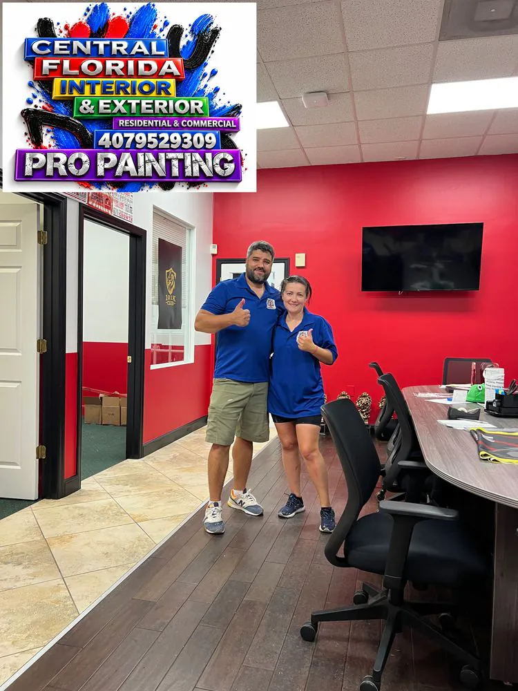 Office painted with a red accent wall